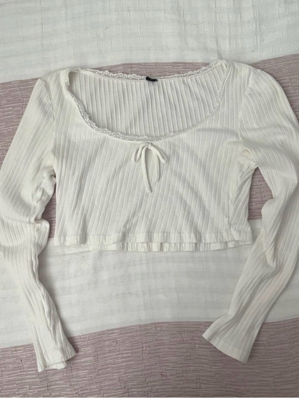 White long sleeve top with lace trim and bow detail
